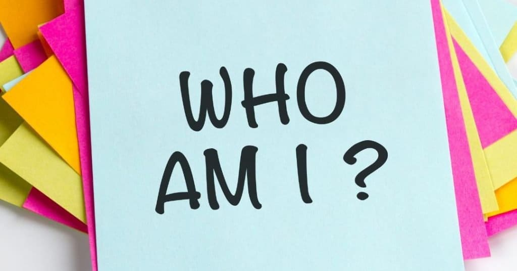 stack of sticky notes with "who am I?" written on them