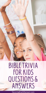 three girls with hands raised ready to answer Bible trivia for kids questions