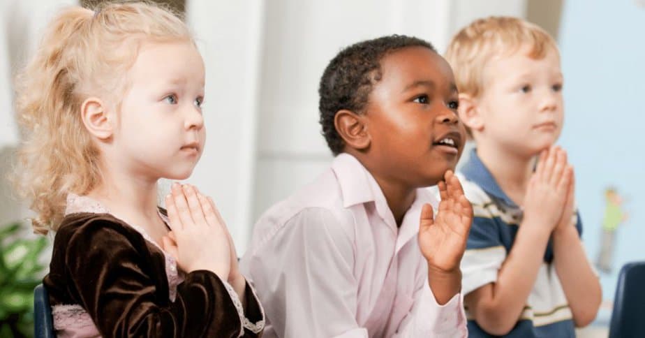 children sitting in church enjoying a new prayer activity