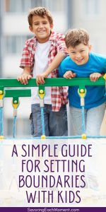 two boys behind a safety barrier as an example of setting boundaries for kids