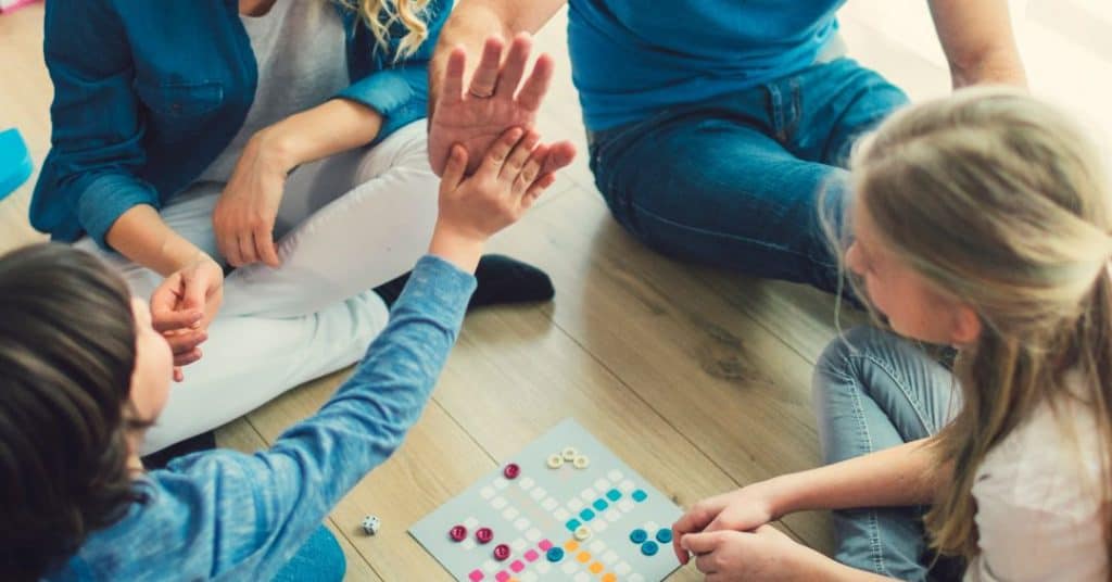 family playing card games for kids together